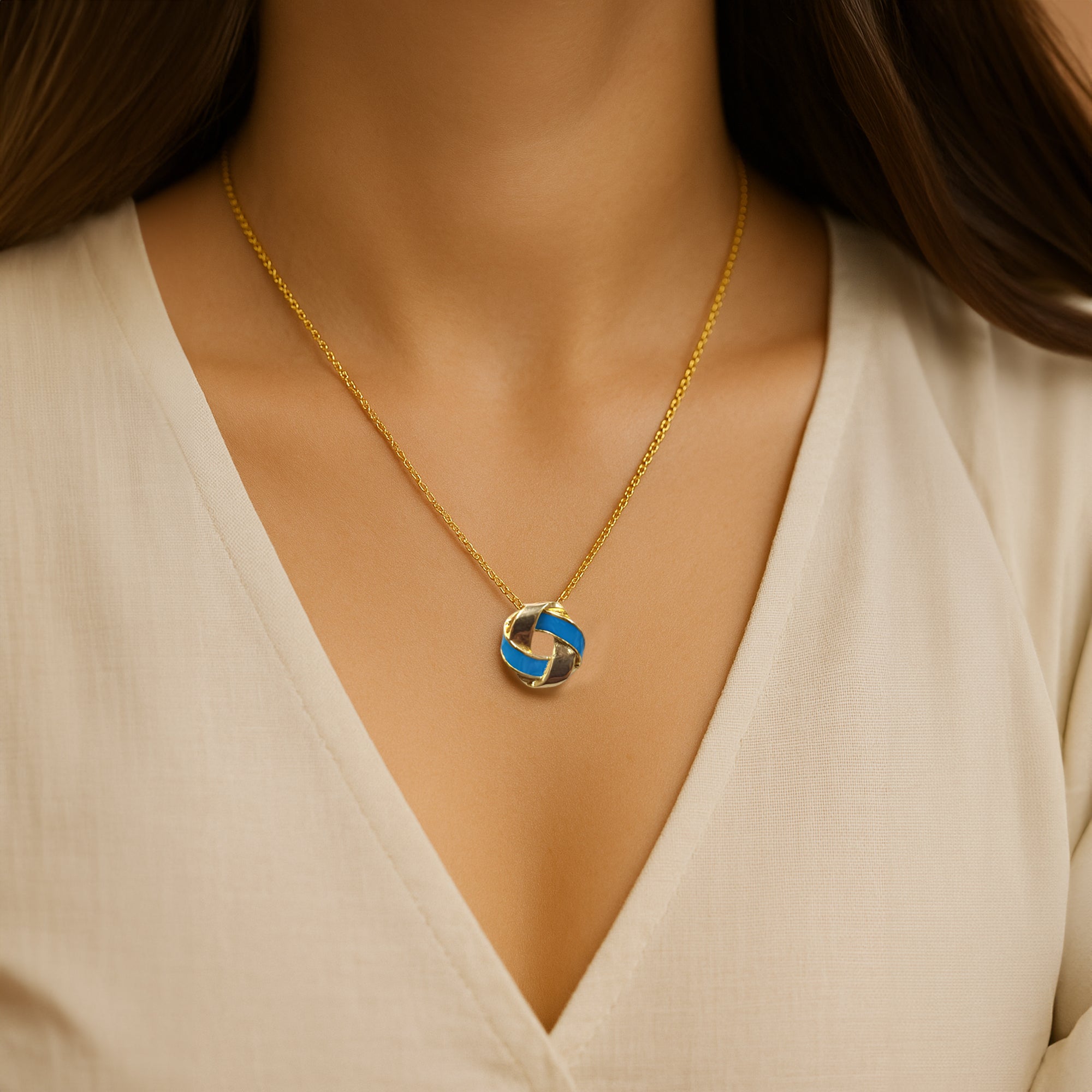 Gold-Coated Silver Knot Pendant Necklace with Blue Enamel