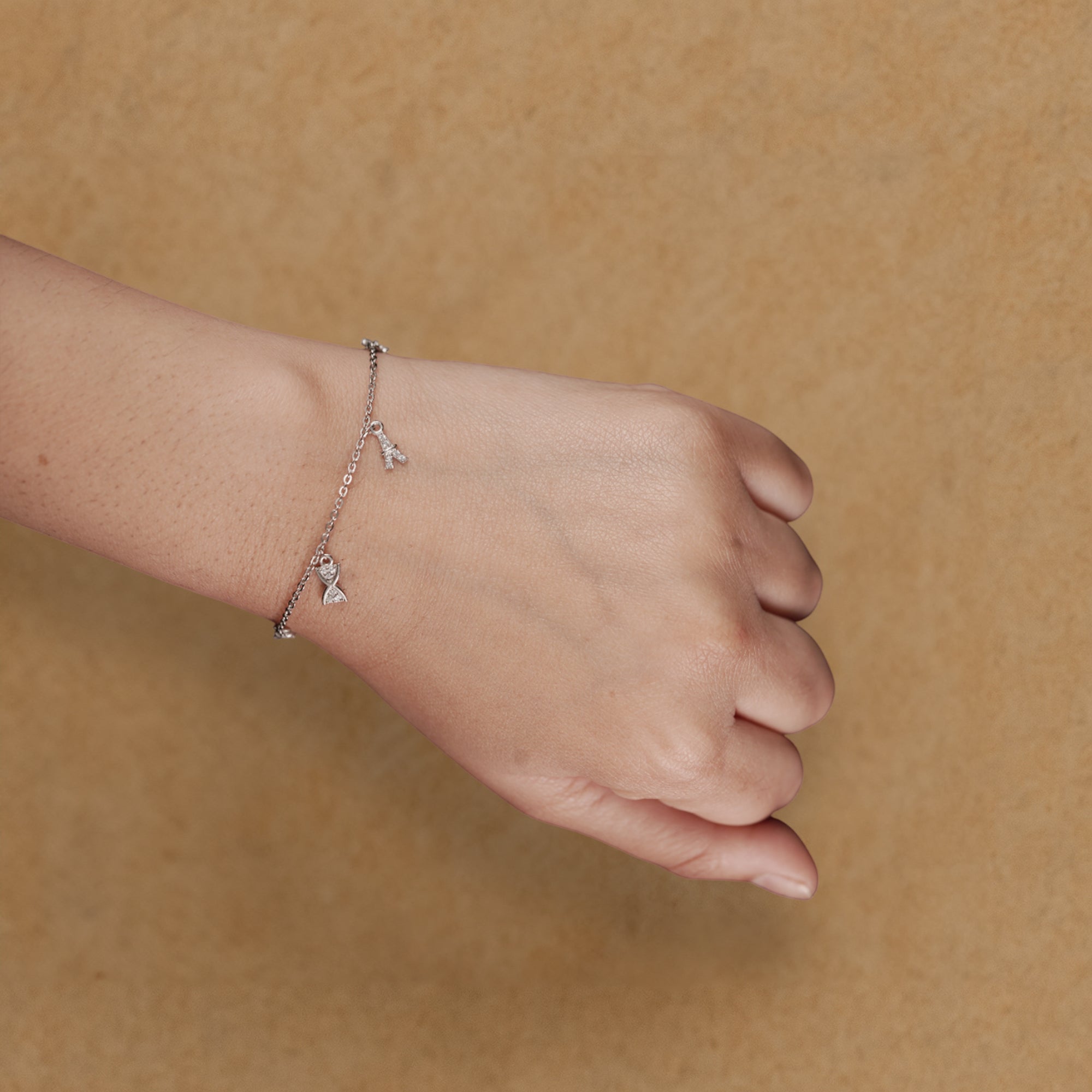 Silver Charm Bracelet with Bow & Star Dangle Accents
