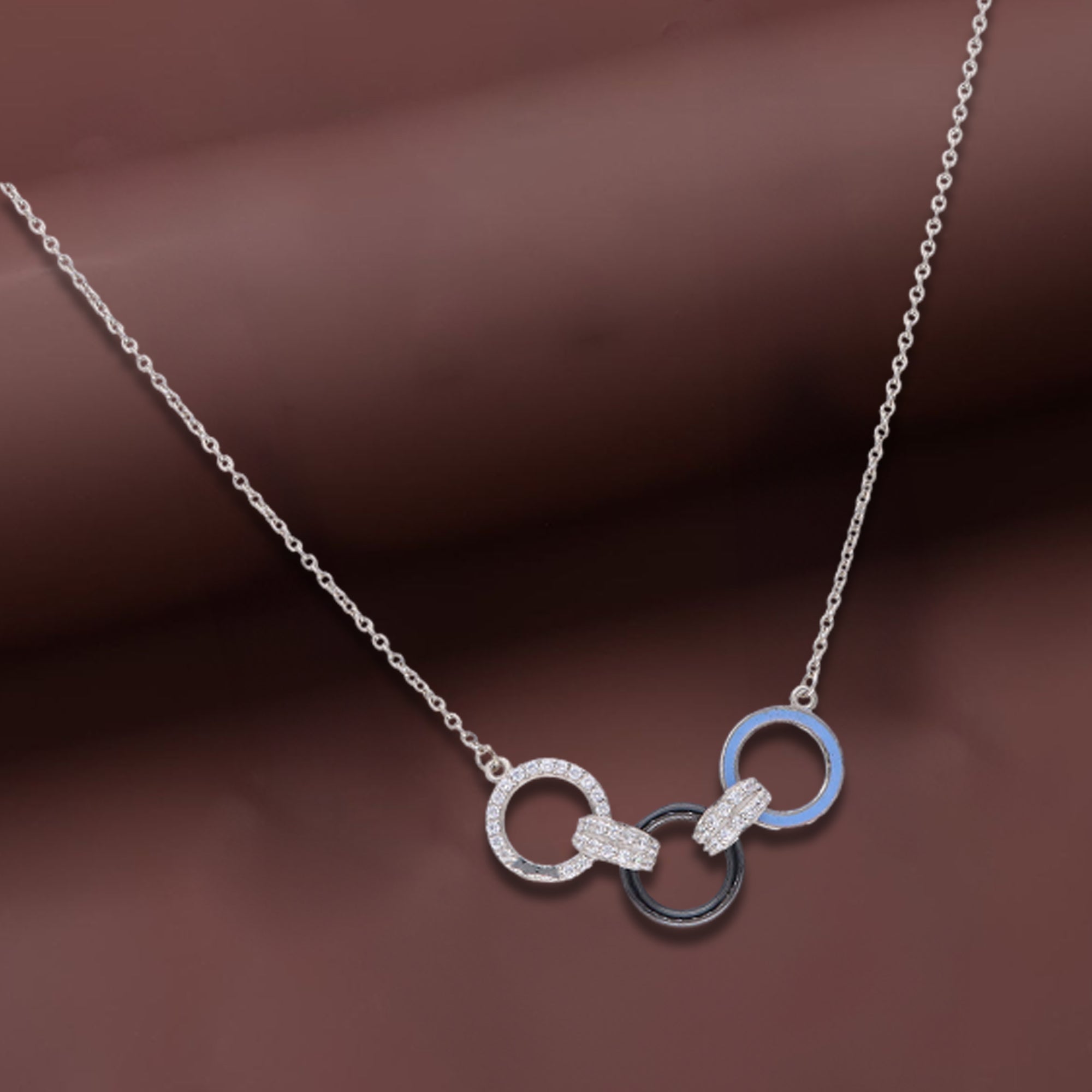 Elegant Interlocking Circle Pendant Necklace – Silver, Black & Blue Accents