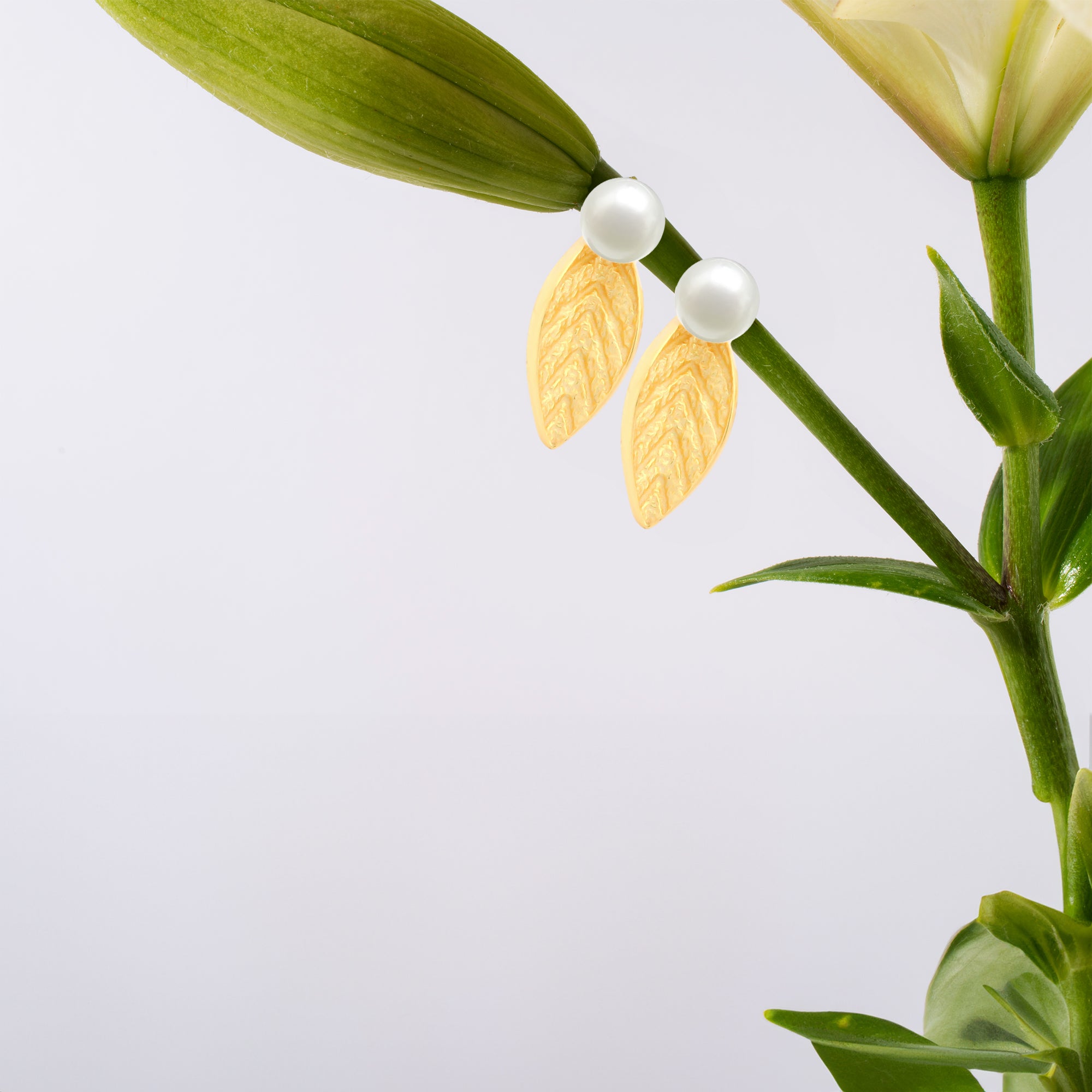 Gold-Plated Leaf Stud Earrings with Pearl Accent